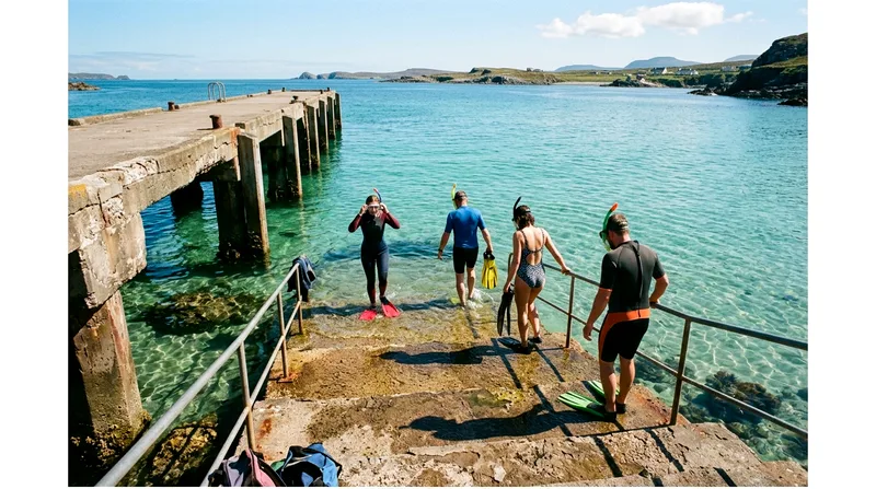 Snorkelers entering water from Mae Haad pier without tour operator present